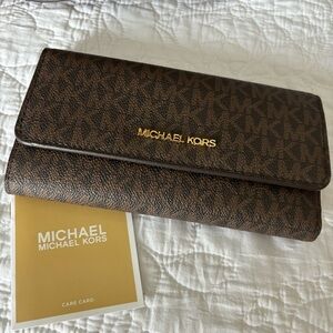 Michael Kors purse with matching wallet.
